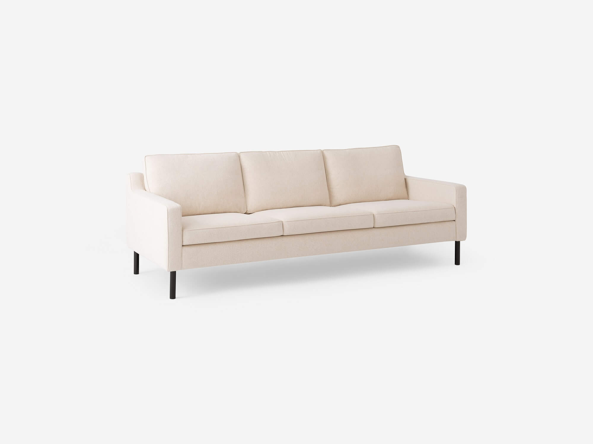 Angled view of the Skye mid century couch in white fabric